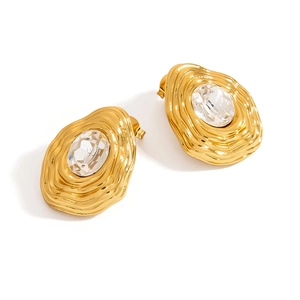 French vintage gold earrings with irregular texture and oval white crystal stones