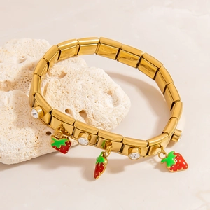 Italian charm bracelet in gold finish with red strawberry enamel pendants and crystals