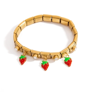 Gold stainless steel stretch bracelet with strawberry charms and crystal accents