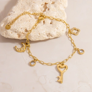 18K gold plated stainless steel bracelet featuring moon and key charms with crystals
