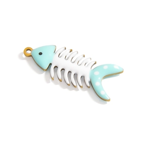 Detailed macro view of a blue and white enamel fishbone pendant with golden metal edges
