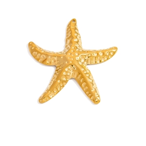 Detailed close-up of golden starfish pendant with textured surface and hanging hole
