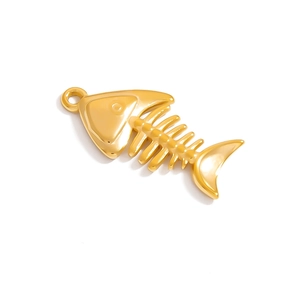 Detailed view of a gold-plated fish bone charm accessory with a polished mirror finish
