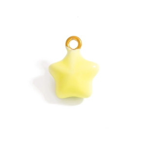 Detail of a light yellow star enamel pendant with a gold metal hook for DIY jewelry making