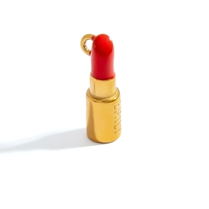 Detail of red and gold lipstick pendant with personalized Emily engraving on the base