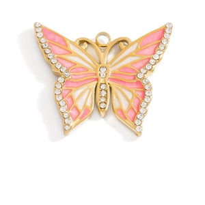Macro detail of butterfly pendant with pink enamel wings and sparkling rhinestones