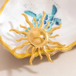 Elegant 18k gold plated stainless steel sunburst brooch with a polished mirror finish