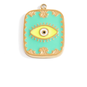Detail of mint green enamel Evil Eye pendant with 18K gold plating and scrolled edges
