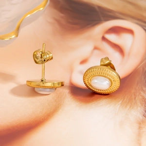 Minimalist gold hoop earrings with white opal stone inlay and embossed dotted texture