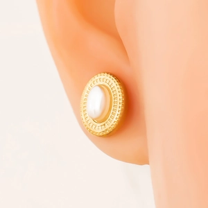 Retro 18K gold plated stainless steel oval pearl stud earrings on female model ear