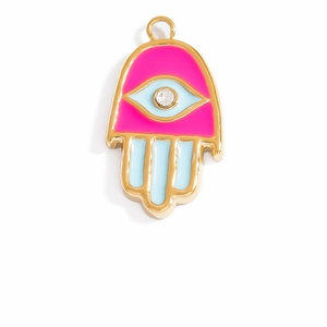 Macro shot of gold Hamsa hand pendant with pink and blue enamel and clear zircon detail