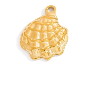 Detailed macro view of a gold-plated shell-shaped stainless steel pendant charm