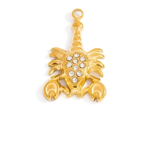 Detailed view of a gold lobster-shaped pendant with nine inlaid clear rhinestones