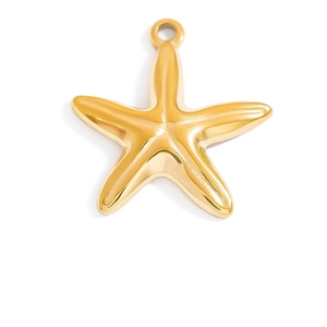 Close-up of a high-polished 18K gold starfish pendant charm for DIY jewelry making