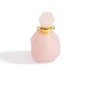 Detailed close-up of rose quartz perfume bottle pendant with gold metal neck and dual rings
