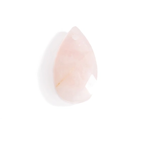 Macro detail of tear drop natural pink quartz stone pendant with pre-drilled hanging hole