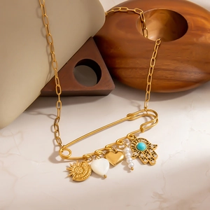 Gold stainless steel pin necklace with shell heart, pearl charms and Hamsa Hand pendant