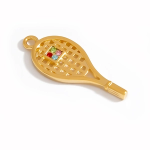 Detailed macro view of a golden tennis racket pendant with colorful inlaid rhinestones