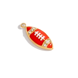 Detail showing a gold-plated red enamel football pendant with crystal accents and white stitching