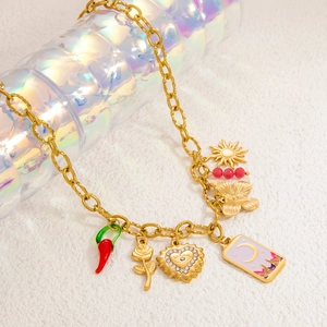 Gold stainless steel link necklace featuring mixed moon, butterfly, and chili pendants