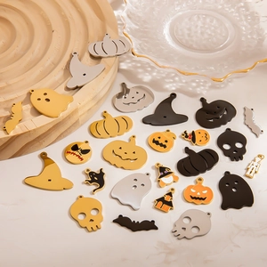 Detailed view of Halloween stainless steel charms including pumpkins and ghosts for DIY