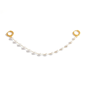 Elegant gold double ear cuff with linked white pearl chain for multi-piercing jewelry styles