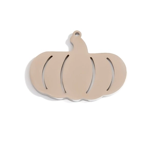 Detailed view of hollow pumpkin pendant in polished golden stainless steel finish