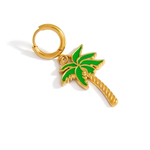 Detail view of gold-plated palm tree earring with green enamel finish and spiral textures