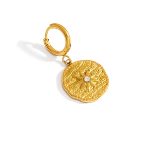 Detailed macro of gold hammered coin drop earring with starburst zircon and smooth leverback