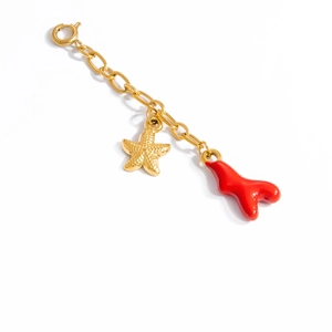 Detailed view of gold starfish and red coral charms on a stainless steel bikini chain link