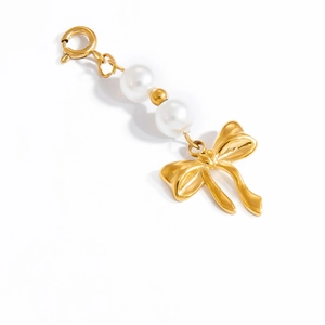 Golden bikini clip with white pearls and a large elegant bow pendant for DIY swimwear
