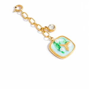 Macro view of gold ocean shell pendant with enamel starfish and white pearls decoration