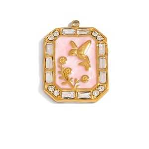 Detail view of rectangular gold floral pendant with pink enamel and sparkling zircon stones