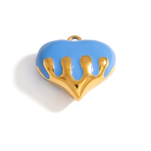 Macro detail of sky blue enamel heart pendant with golden metallic border and top ring
