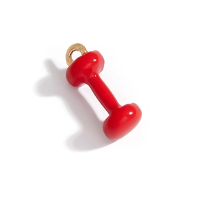 Vue macro d'un pendentif en forme d'haltère rouge et or pour accessoires bijoux DIY