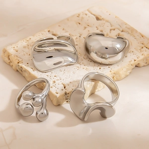Set of 4 minimalist irregular silver titanium steel rings with liquid metal texture style