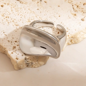 Minimalist polished titanium steel ring with an irregular wavy design and mirror finish