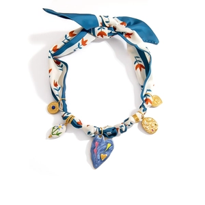 Bohemian silk scarf necklace with blue heart pendant and vintage golden charms on white