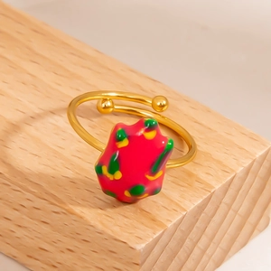 Detailed close-up of a 18K gold-plated open ring with a red dragon fruit enamel design