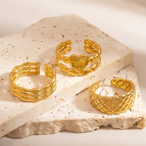 Three-piece gold adjustable ring set with bamboo texture, heart motif, and lattice band