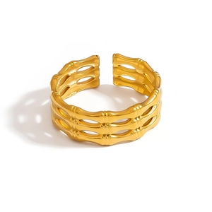 Adjustable gold bamboo-style cuff bracelet with a hollow triple-layered metal design