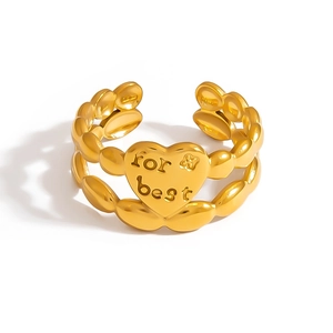 Close-up of golden adjustable heart ring with for best engraving and beaded band details