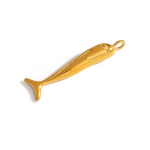 Detailed macro view of gold-plated movable fish pendant with polished mirror finish