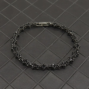 Close-up of black rhodium plated tennis bracelet with cluster links and folding clasp