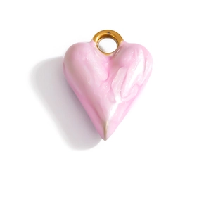 Detail of a pink enamel heart pendant with golden ring and marble texture on white background