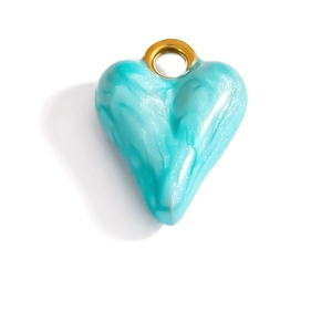 Detailed view of heart charm with tiffany blue marble texture and golden loop