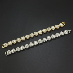 Bracelet tennis cœur glacé en or et argent avec des pierres de zircone étincelantes
