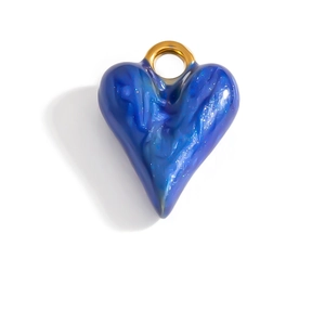 Detailed view of heart-shaped stainless steel pendant with blue starry sky glitter texture