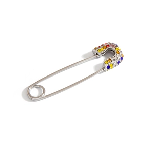 Polished silver safety pin brooch with colorful gradient rhinestones on white background