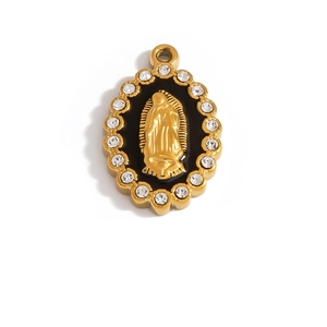Macro shot of gold Virgin of Guadalupe oval pendant with black enamel and crystals